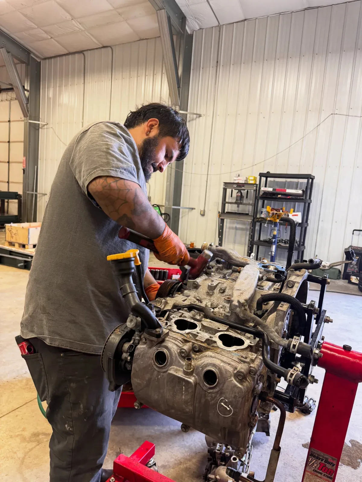 Mechanic working on a boxer engine
