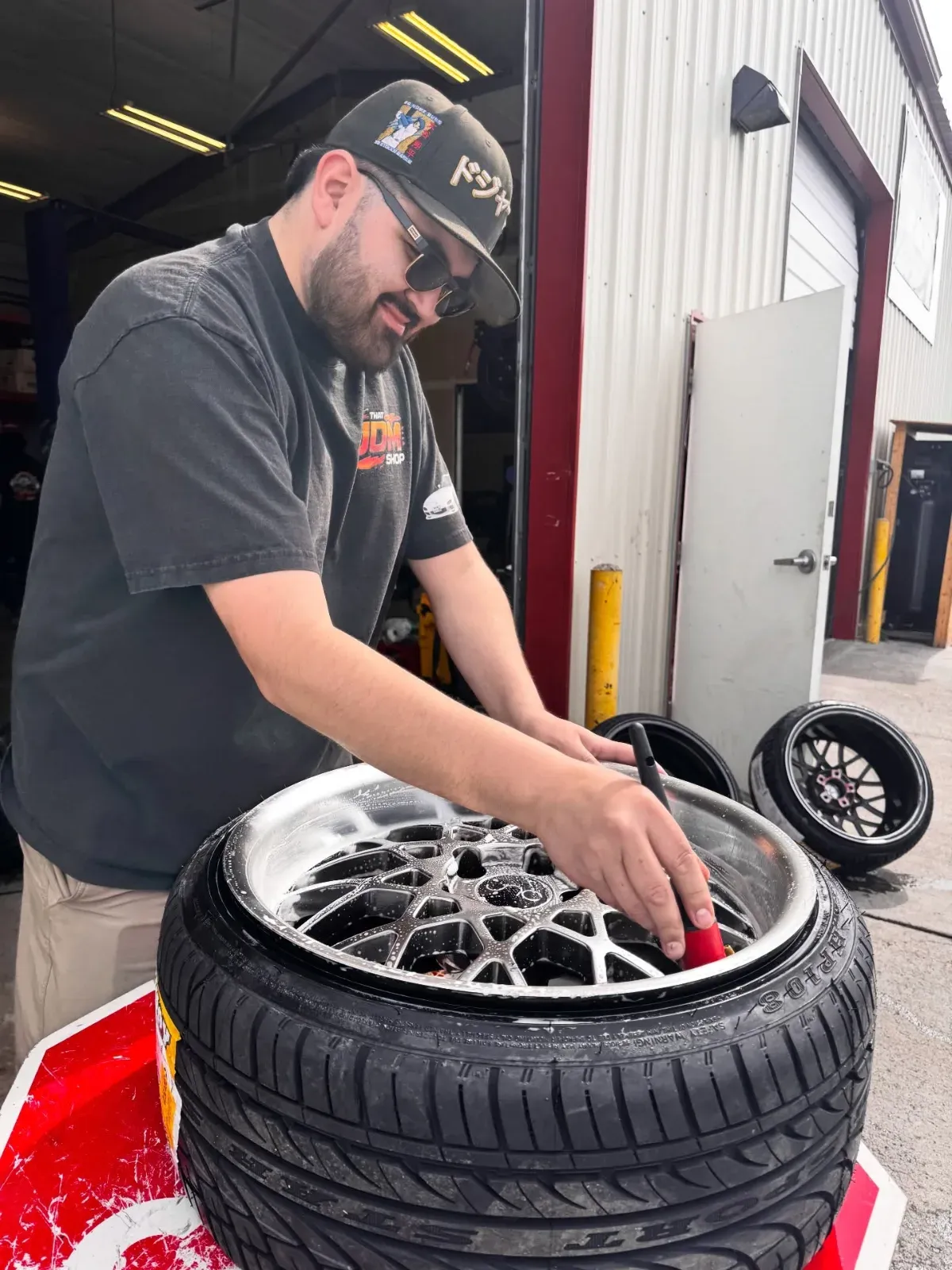 Technician cleaning a wheel