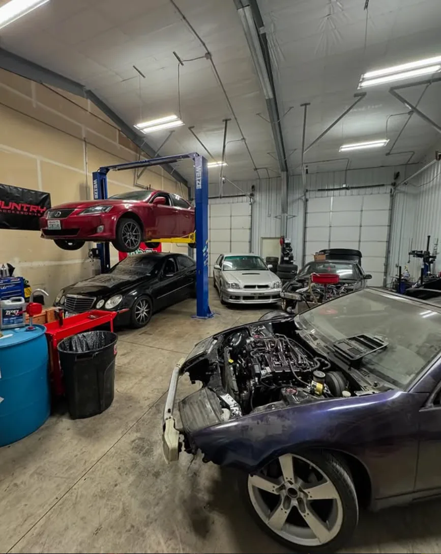 Inside That JDM Shop — cars on lifts and an open engine bay